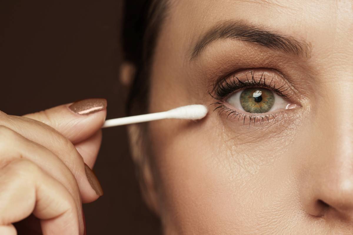 Woman taking care of her eyelids.